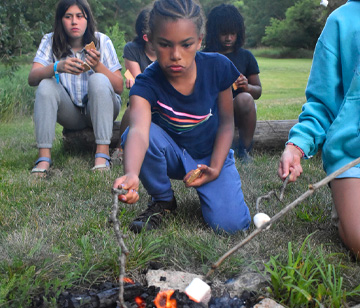 Campfires. There’s something hypnotizing about the crackle and colors of each flame. And it’s even more magical when the fire is surrounding by campers singing, sharing their camp experiences, and listening to stories around the campfire.