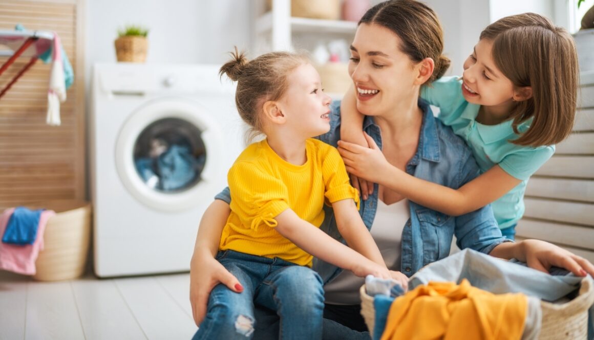 Kids building life skills by assisting mom with laundry.